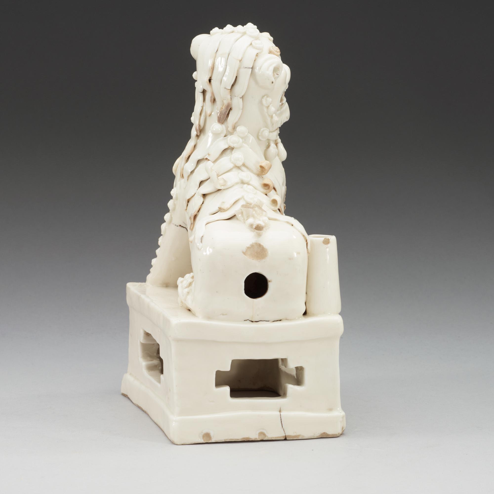 A blanc de chine censer, in the shape of a sitting Buddhist lion, Transition, 17th Century.