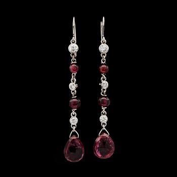 106. A pair of garnet and diamond earrings.