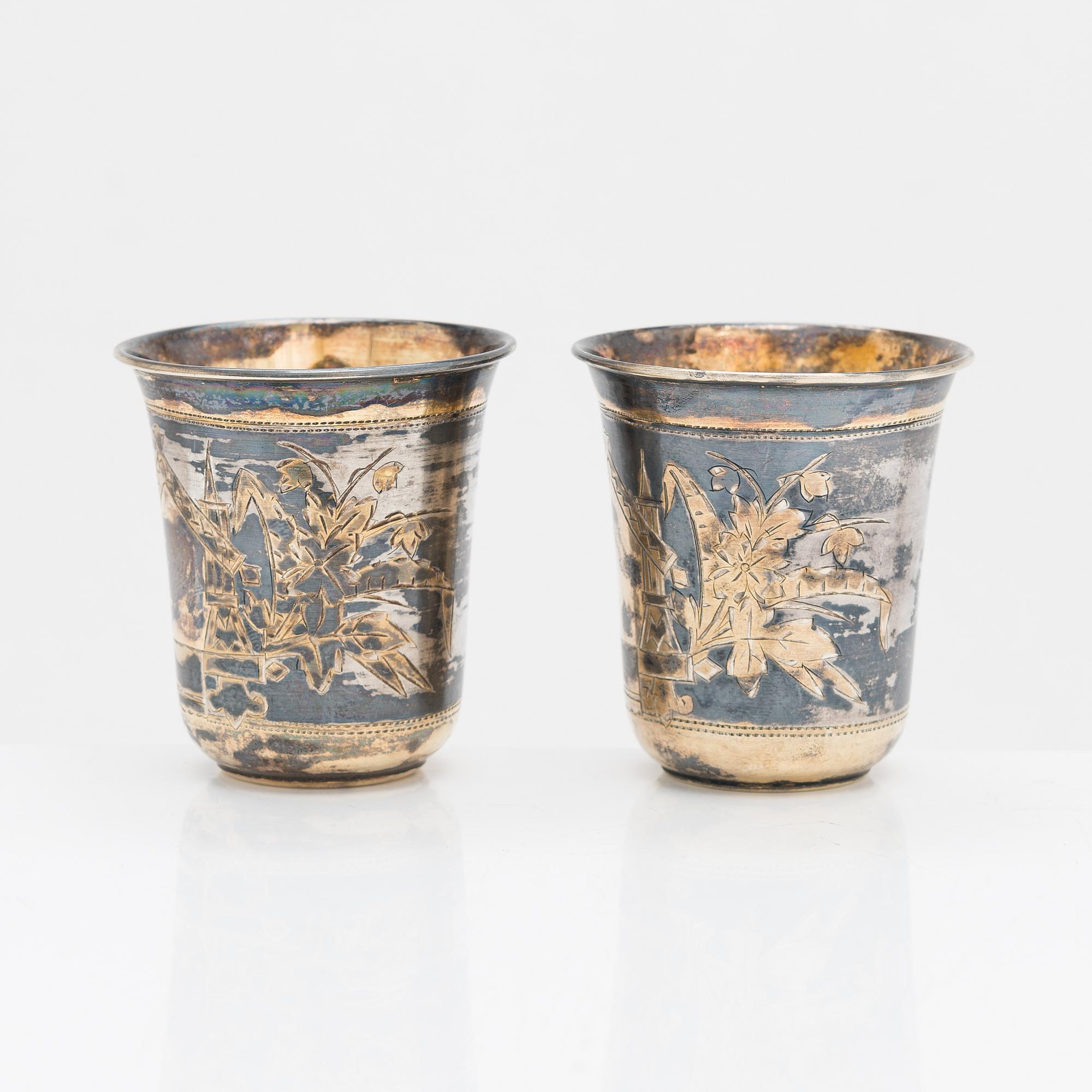 Four parcel-gilt silver beakers, Moscow 1870, 1876 and 1890.