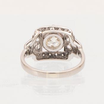 An 18K white gold ring set with an old cut diamond and rose cut diamonds.