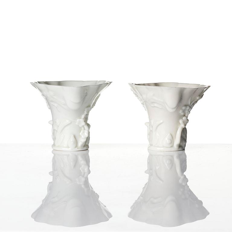 A pair of blanc de chine rhinoceros libation cups, Qing dynasty, Kangxi (1662-1722).
