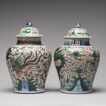 Two Transitional Wucai Baluster vases and covers, 17th Century.