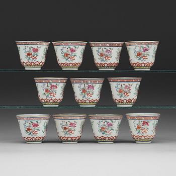 65. A set of eleven famille rose ba jixiang wine cups, Qing dynasty, with Guangxu six character mark and period (1874-1908).
