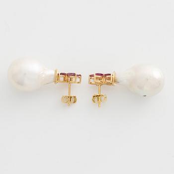 Earrings with cultured baroque freshwater pearls and pink sapphires.