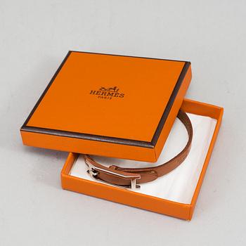 HERMÈS, a scarf and a bracelet.
