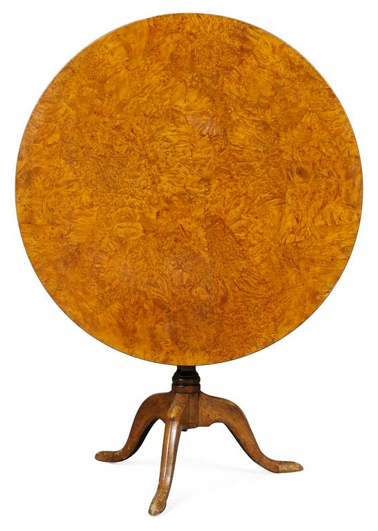 A Swedish tilt top table by L. E. Lindell.