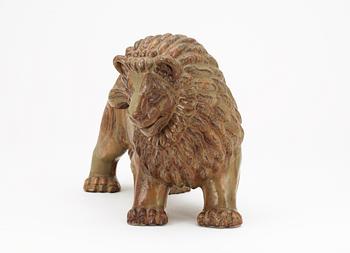 A Gunnar Nylund stoneware figure of a lion, Rörstrand.