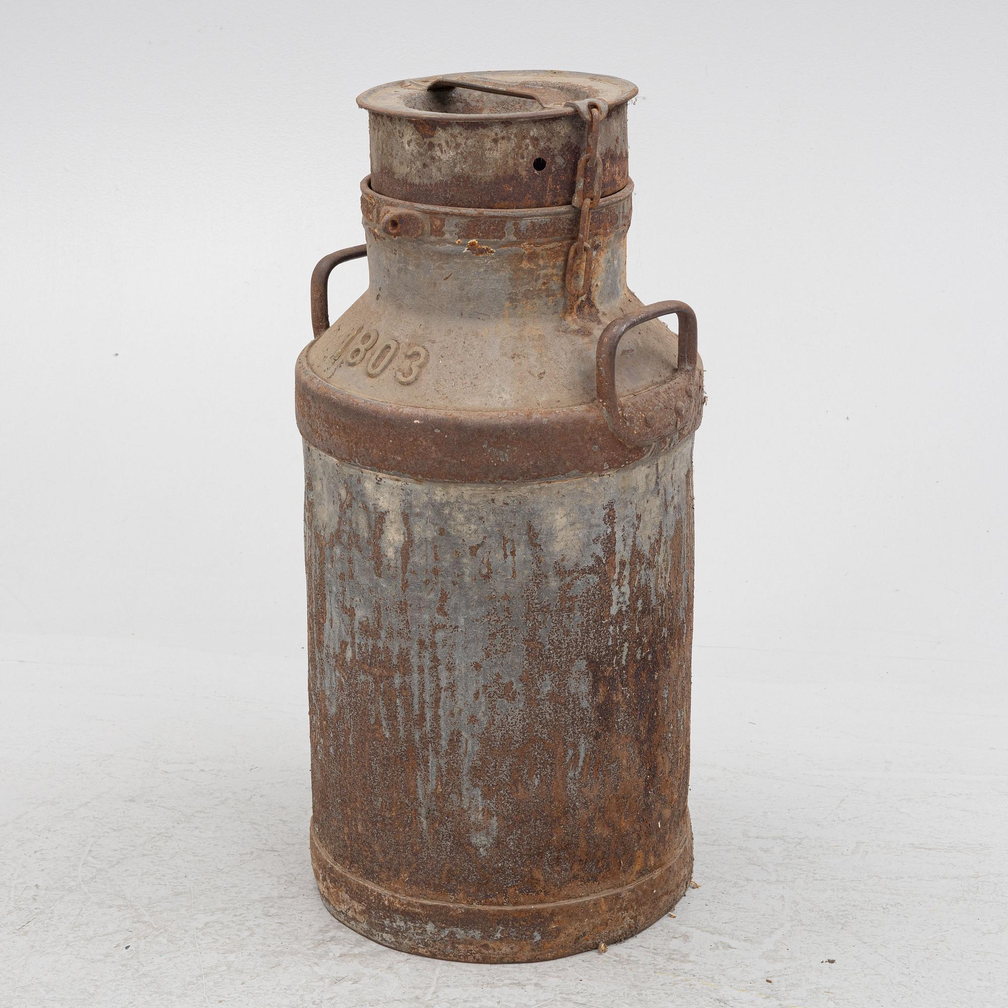 A milk pail, numbered 1803.