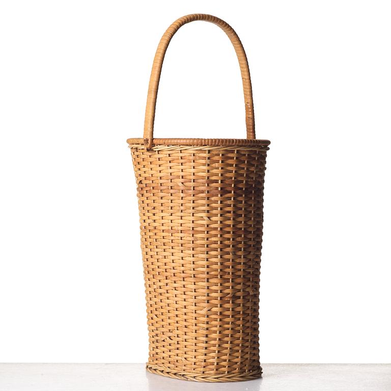 Firma Svenskt Tenn, a fretted rattan umbrella stand, mid 1900's, provenance Estrid Ericson.