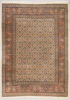 An oriental carpet. Circa 345x245 cm.