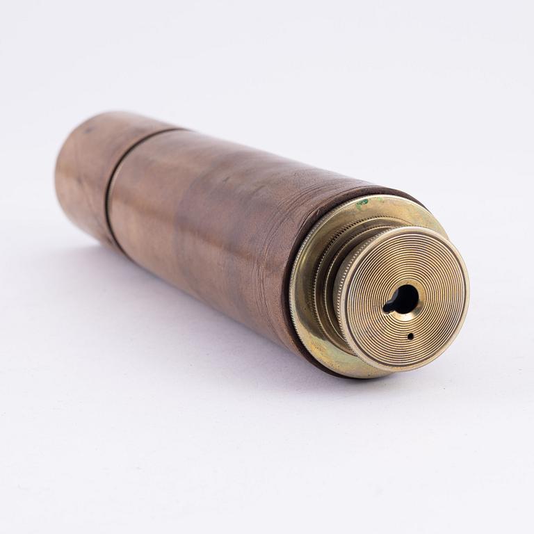 A brass spotting scope from I. H. Steward, London, circa 1900.