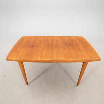 A 1950s teak dining table.