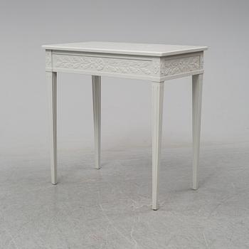 A late Gustavian style table with a drawer from around year 1900.