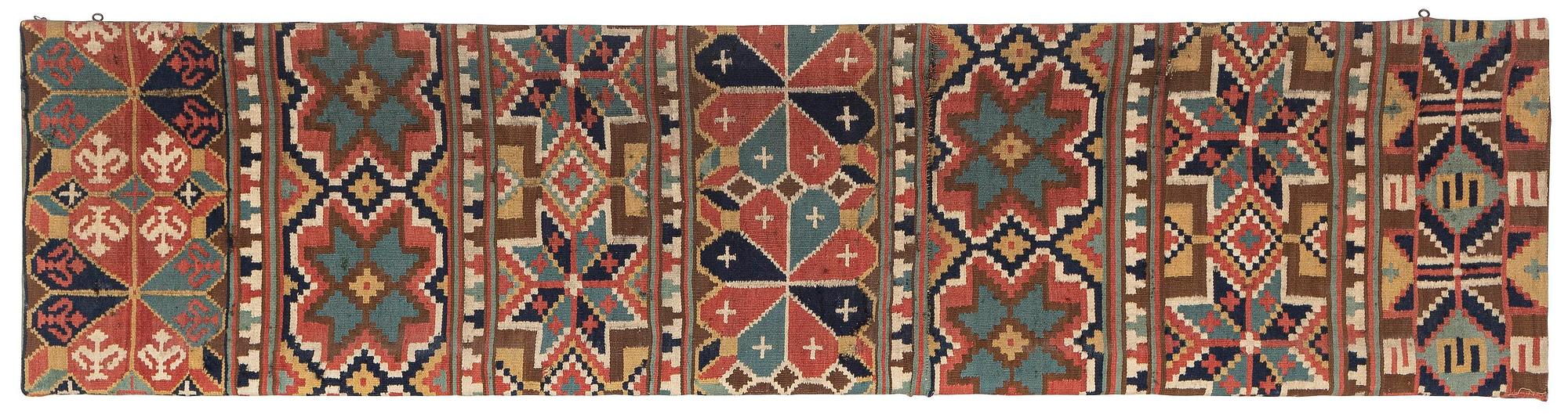 A flat weave 'Rosettes', Bench cushion c. 205 x 50 cm, Southwestern Scania, Sweden, first half of the 19th century.