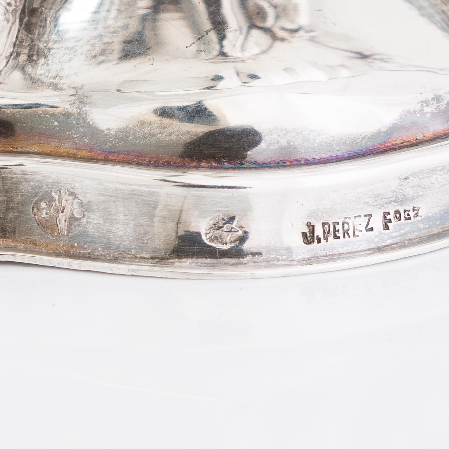 A Spanish silver bowl, maker's mark J. Perez Fernandez, and a silver salt cellar, Platería López, Madrid.