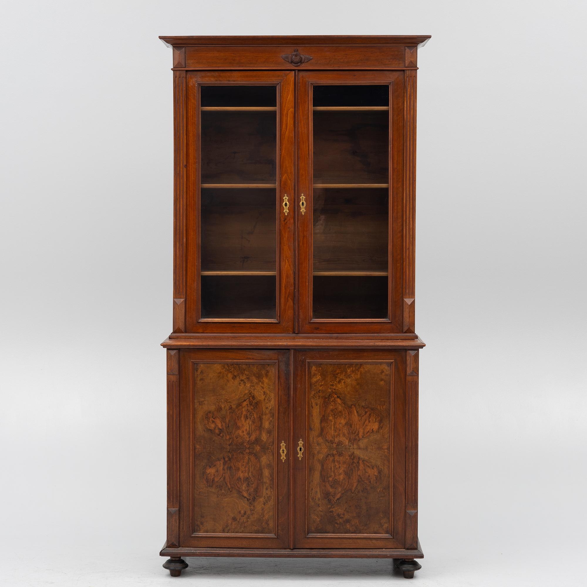 A two part mahogany cabinet, around 1900.