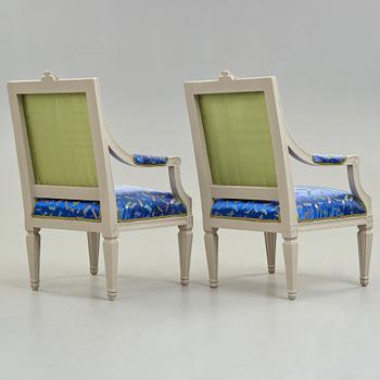 A pair of large Gustavian late 18th century armchairs.