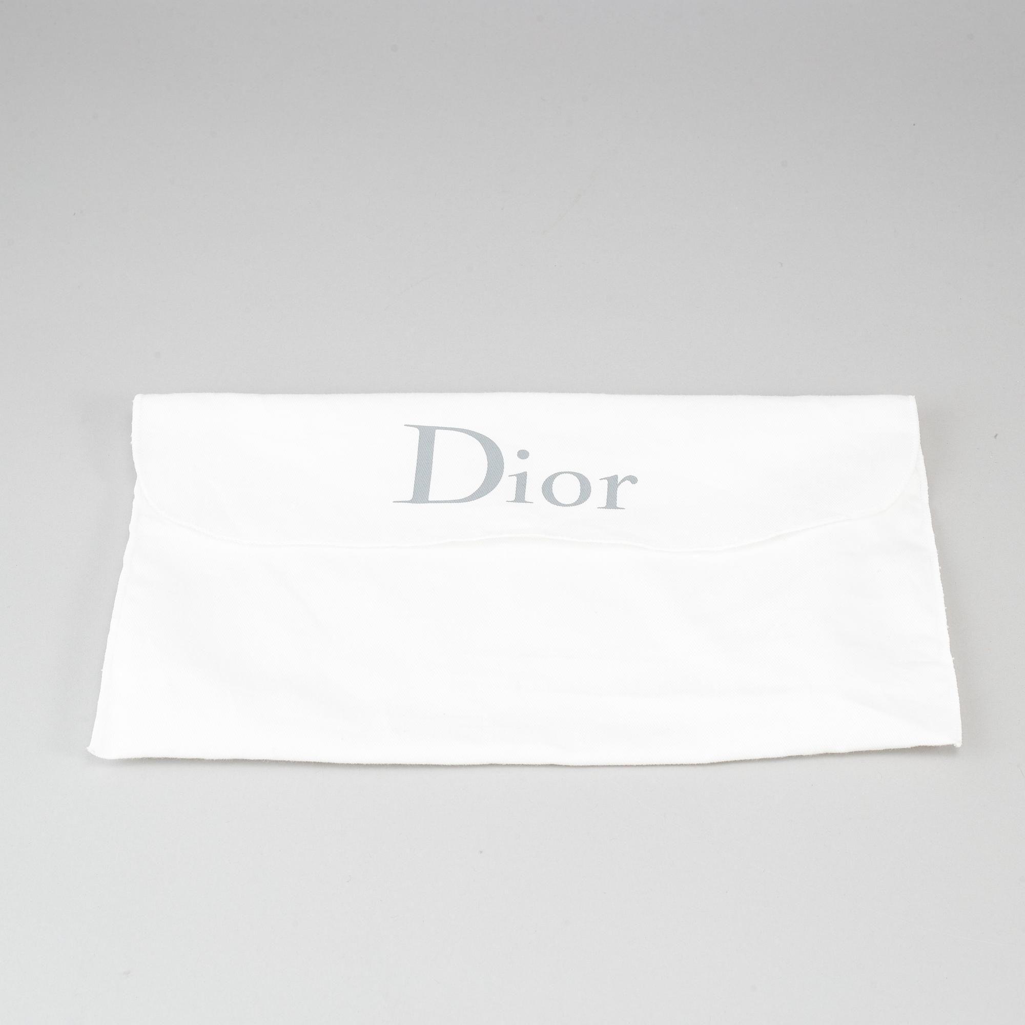 CHRISTIAN DIOR, an embossed metallic leather 'Wallet on Chain' clutch.