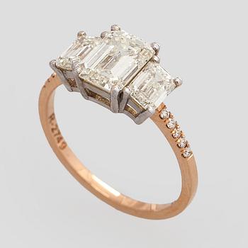 Ring, three baguette cut diamonds, small brilliant cut diamonds, 18K white gold and rose gold.