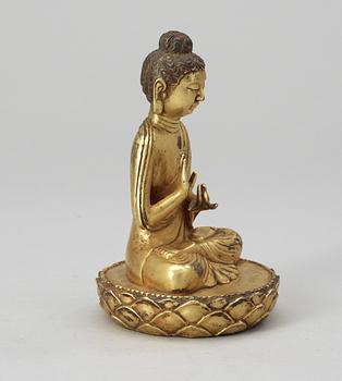 A gilt bronze Buddha, late Qing dynasty.