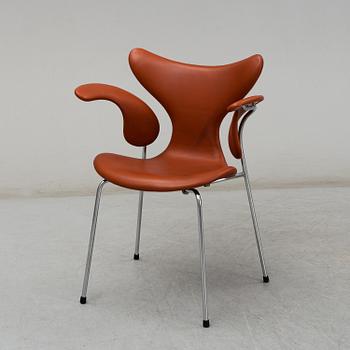 ARNE JACOBSEN, a 'Lily' leather covered armchair from Fritz Hansen, Denmark.