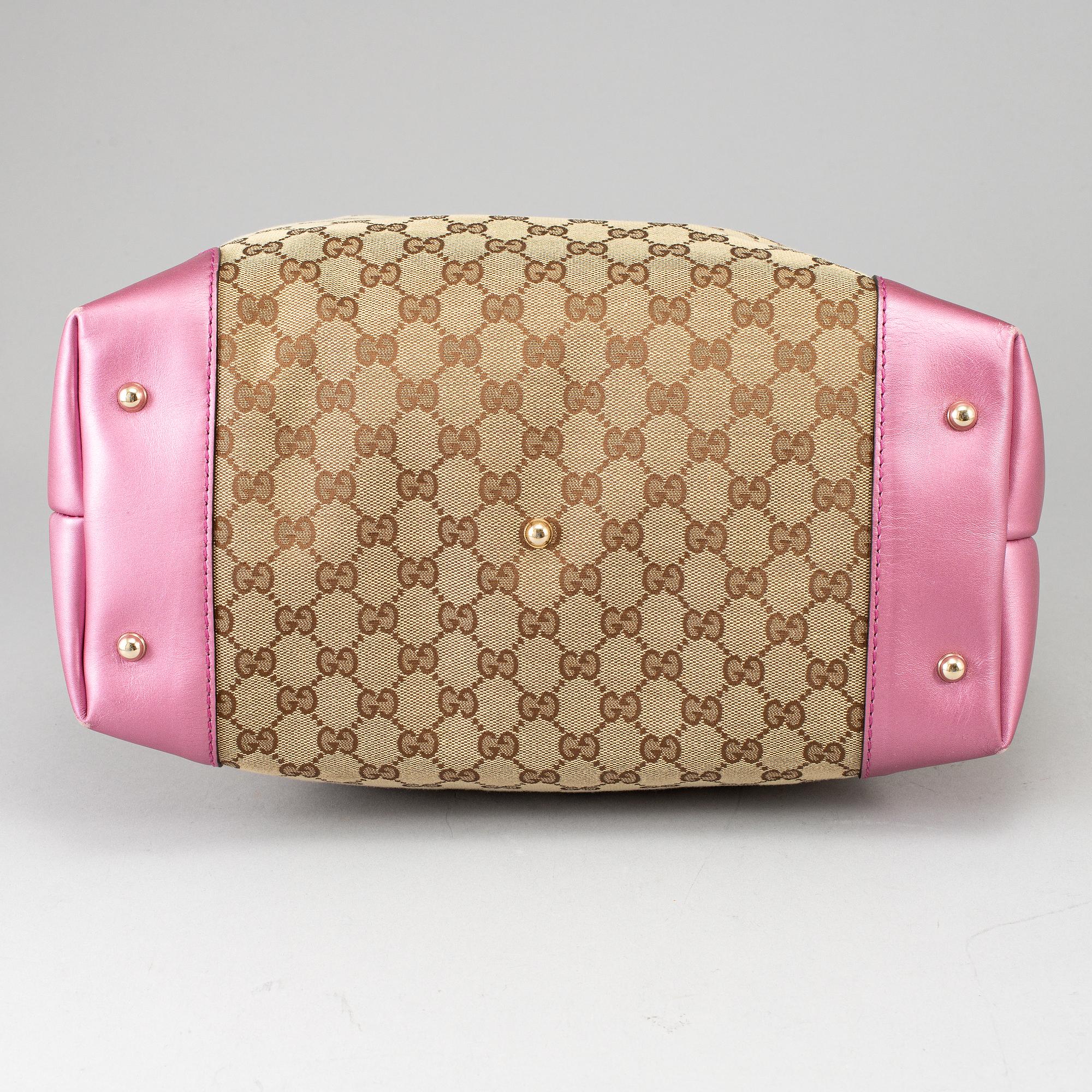 GUCCI, a monogram canvas and pink metallic leather handbag.