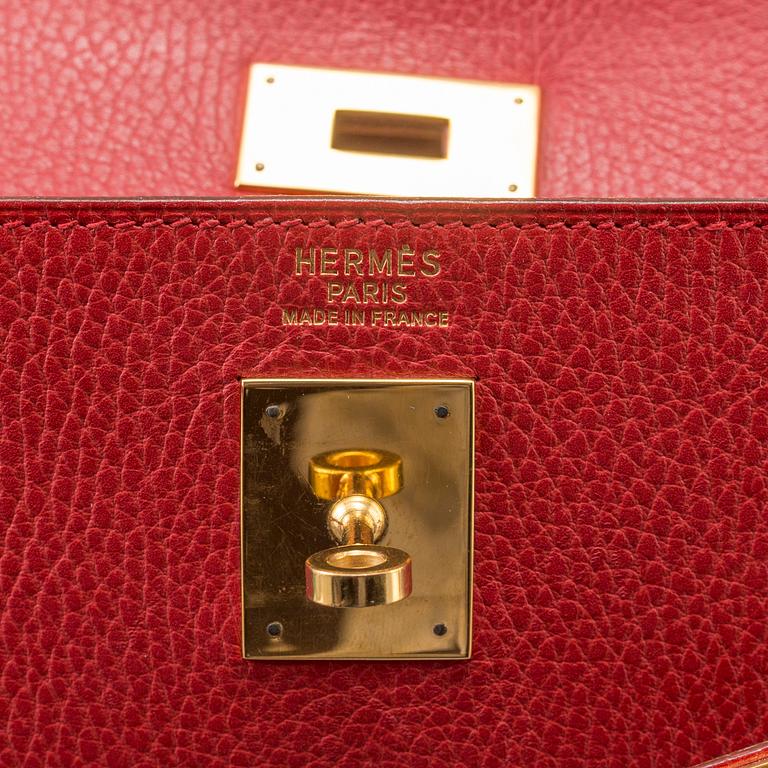 A red Epson "Kelly 40" bag by Hermès 1991.