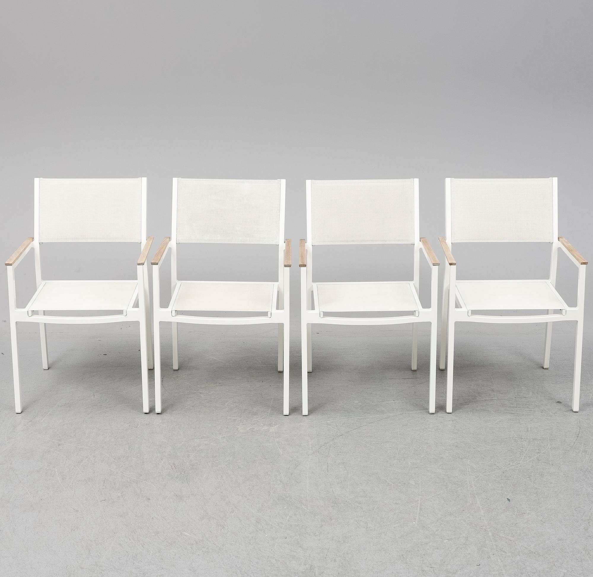 A garden table with four chairs, Gloster.