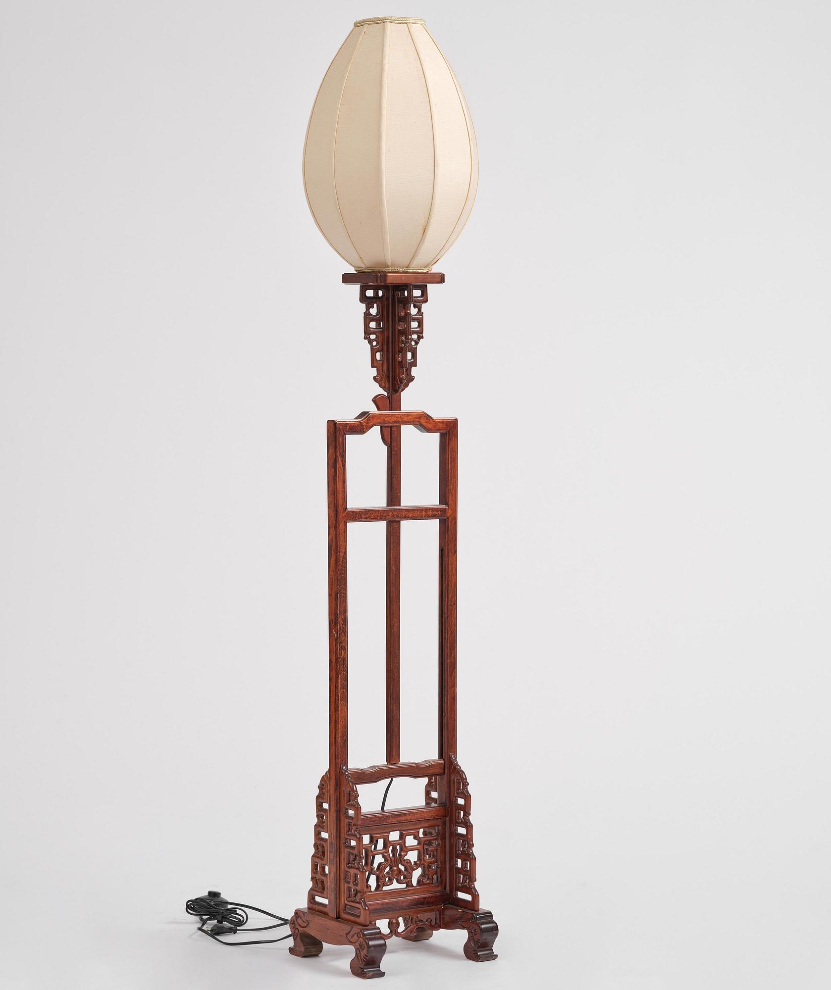 A Chinese wooden floor lamp, later part of the 20th century.