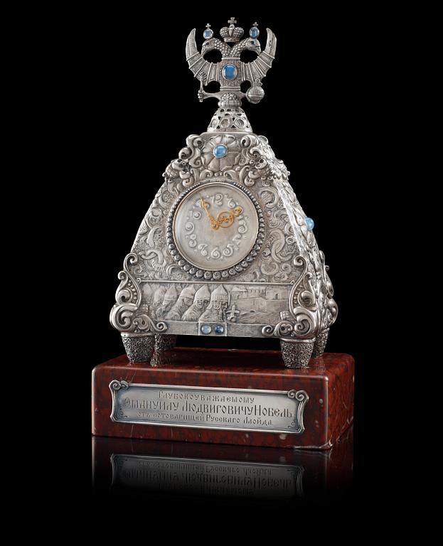 A RARE SILVER FABERGÉ CLOCK, Moscow 1908-1917. Imperial Warrant and scratched inventory no 17689.