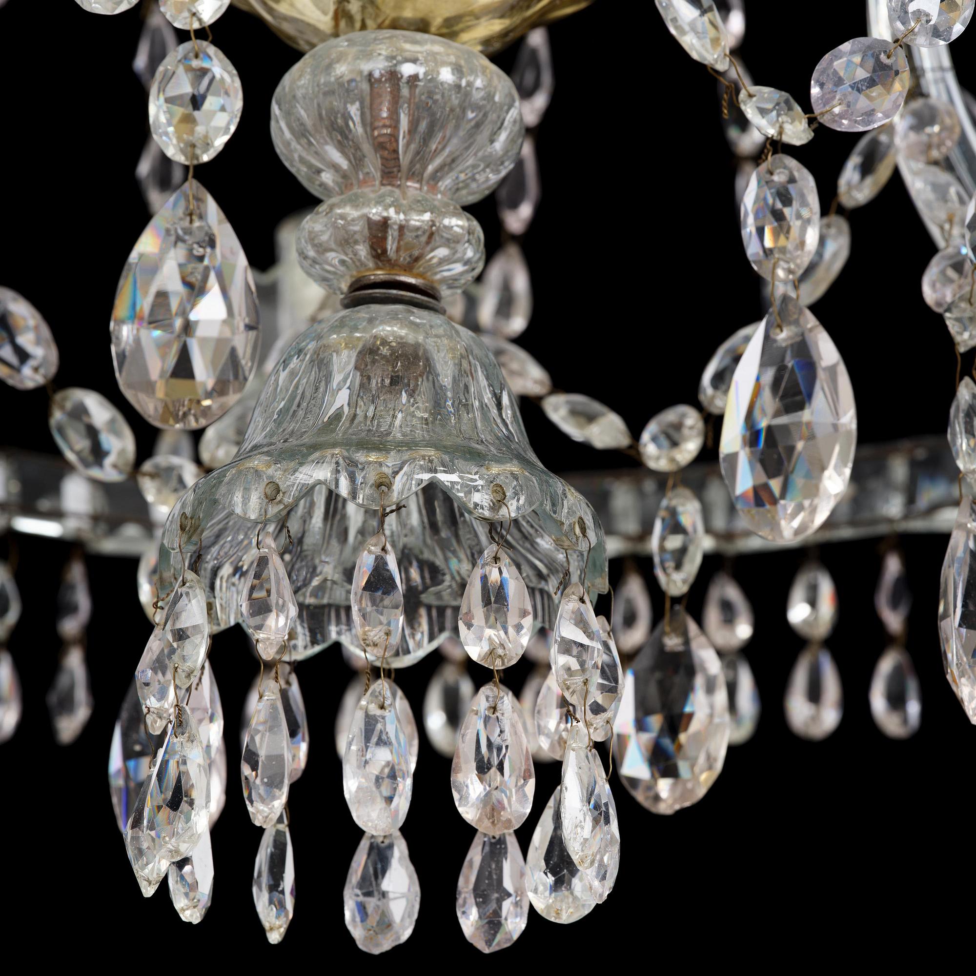 A Bohemian Louis XVI moulded and cut-glass six-branch chandelier, late 18th century.