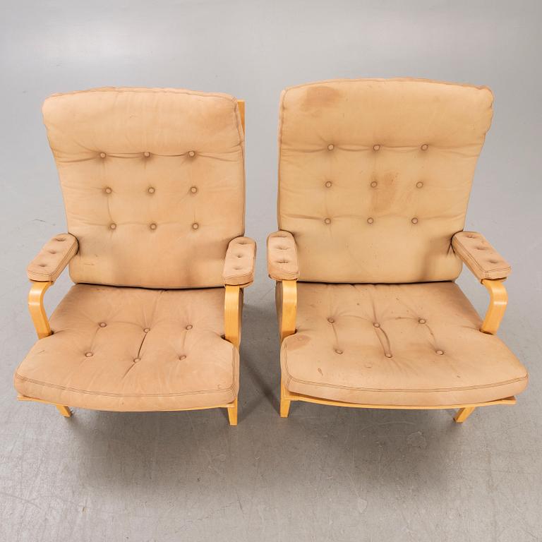 A pair of Bruno Mathsson Ingrid leather armchairs later part of the 20th century.