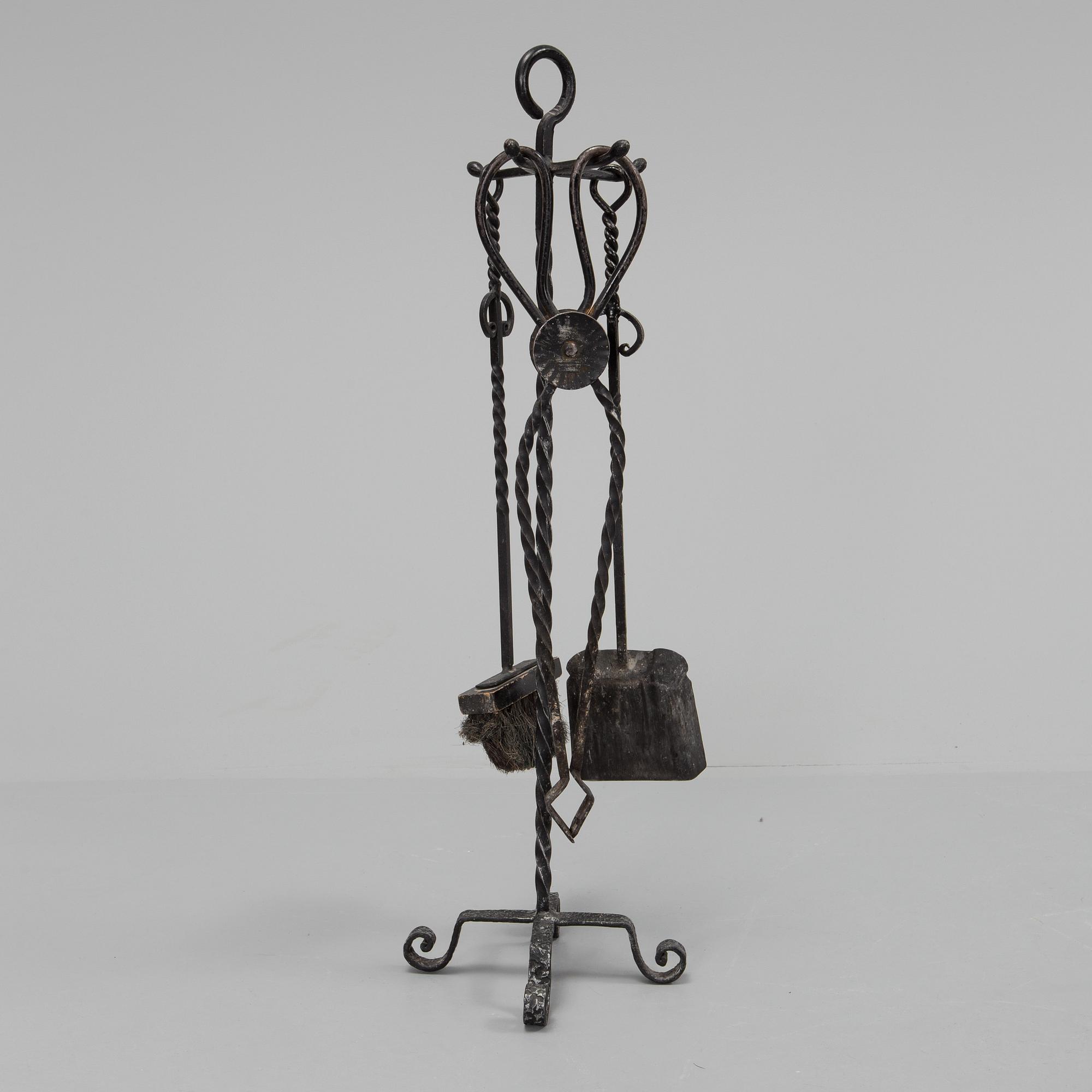A set of wrought iron fire utensils.