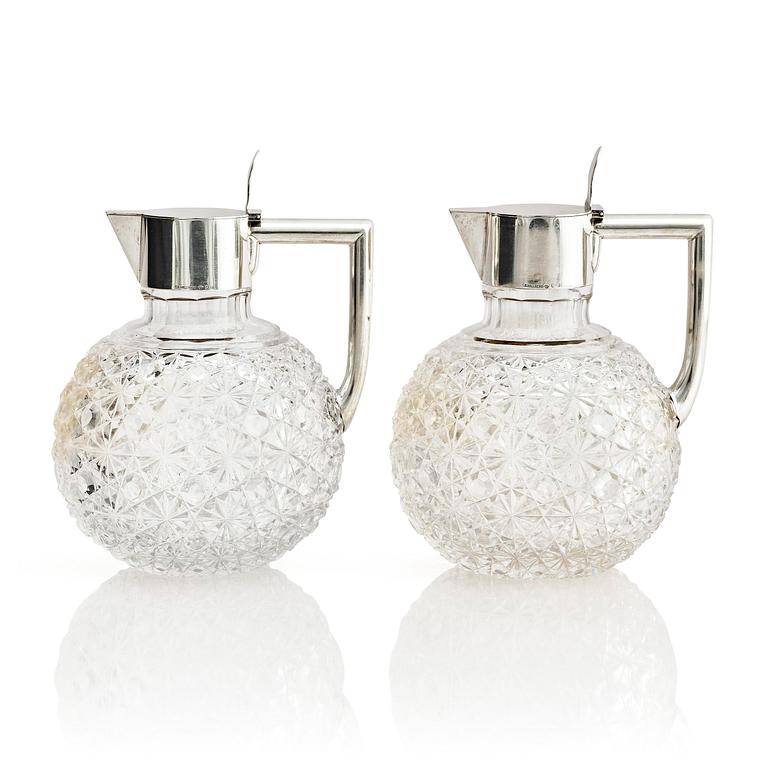 A Swedish pair of silver and cut-glass decanters, mark of C.G. Hallberg, Stockholm 1893.