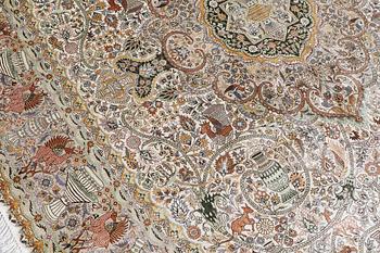 An oval pictoral silk carpet, ca 273 x 180 cm.