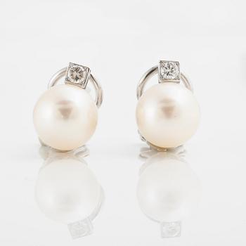 A pair of cultureds pearl and circa 0.15 cts brilliant-cut diamond earrings.