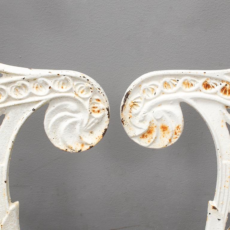 A pair of ends for a garden sofa, cast iron, 20th century.