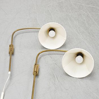 A pair of brass wall lamps, model 2484, designed by Josef FranK, Firma Svenskt Tenn.