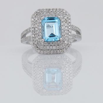 RING, 14k vitguld med topas 2,82 ct och diamanter tot ca 0,92 ct. Vikt ca 4,5 g.