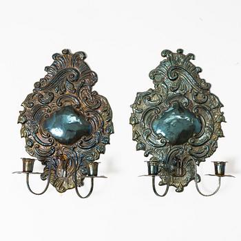 A pair of Rococo-style silver-plate sconces, early 20th century.