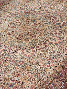 A semi-antique/old Kerman carpet, around 361 x 264 cm.