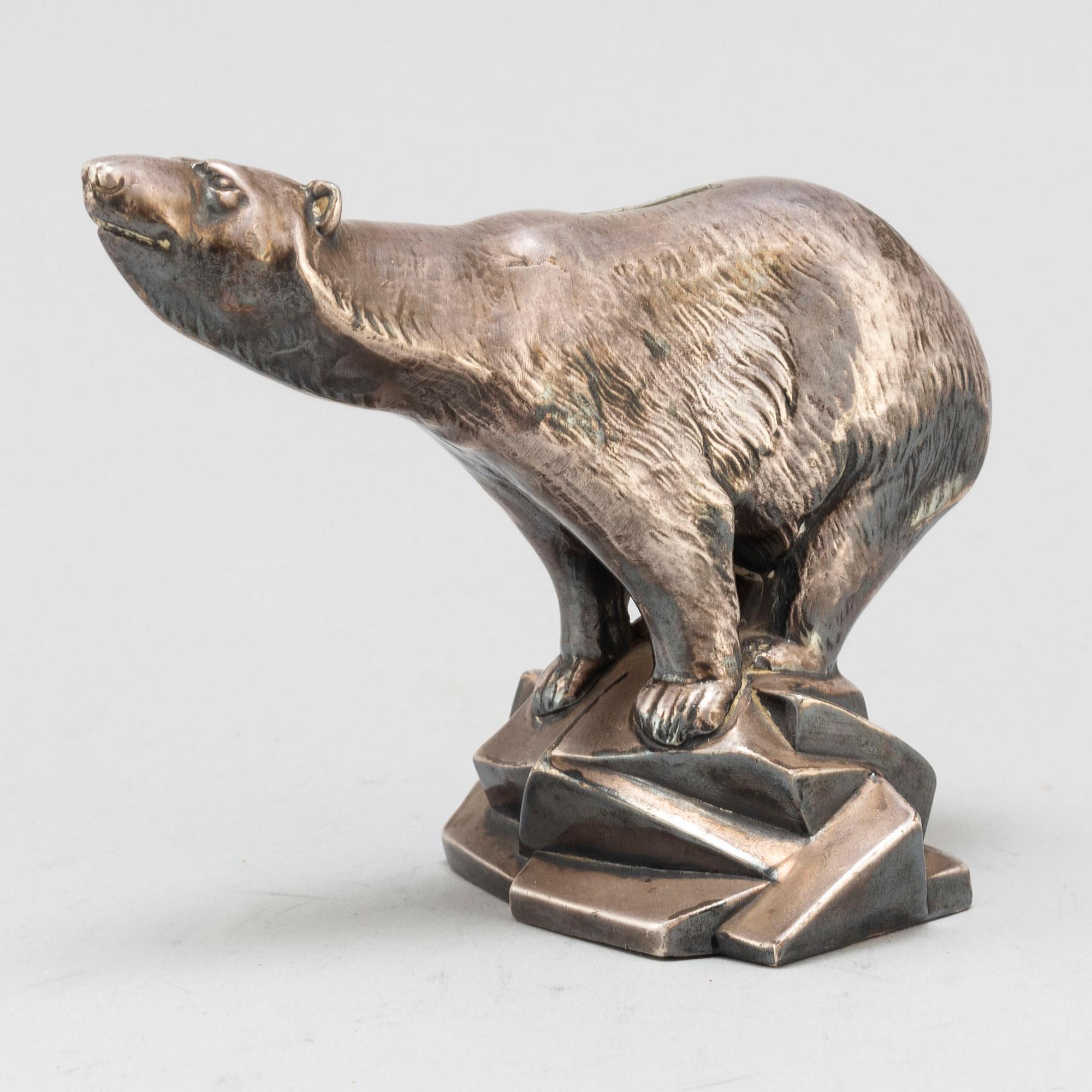 CHARLES SVEJSTRUP MADSEN, a silver plate paperweight.