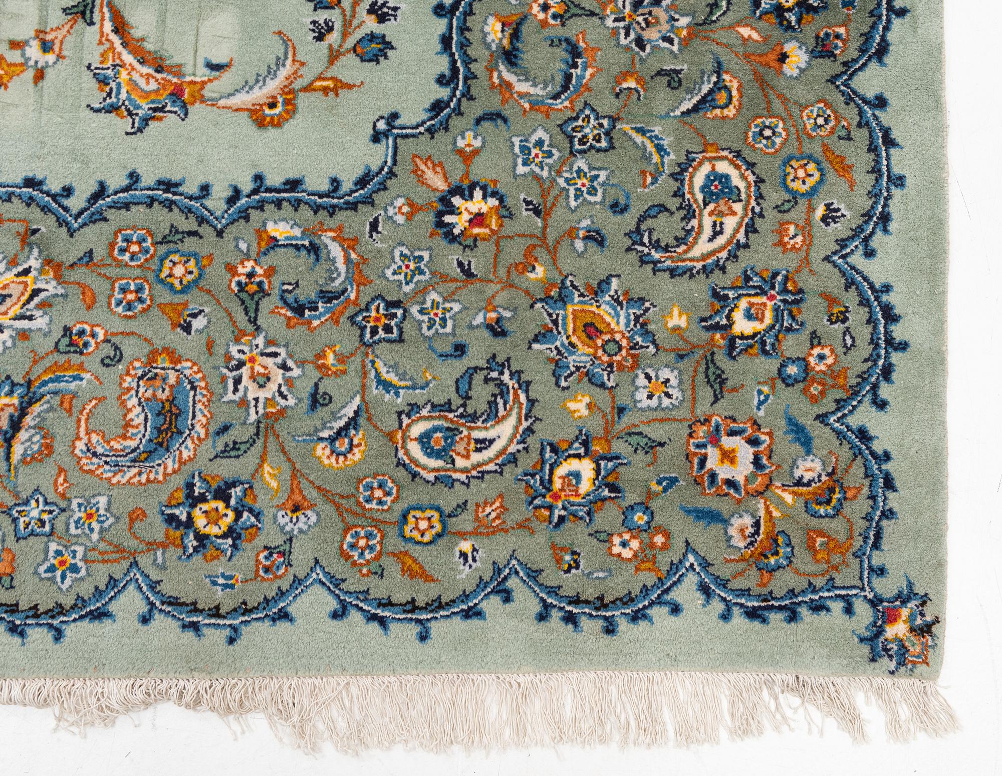 A Keshan carpet, signed, c. 376 x 270 cm.