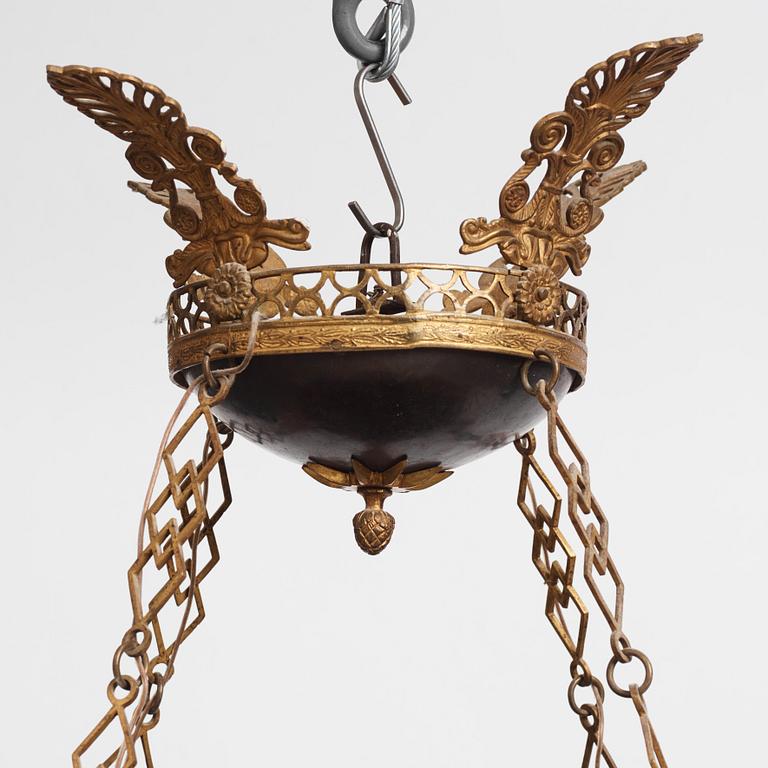 A presumably Russian Empire gilt and patinated bronze nine-branch chandelier, 19th century.