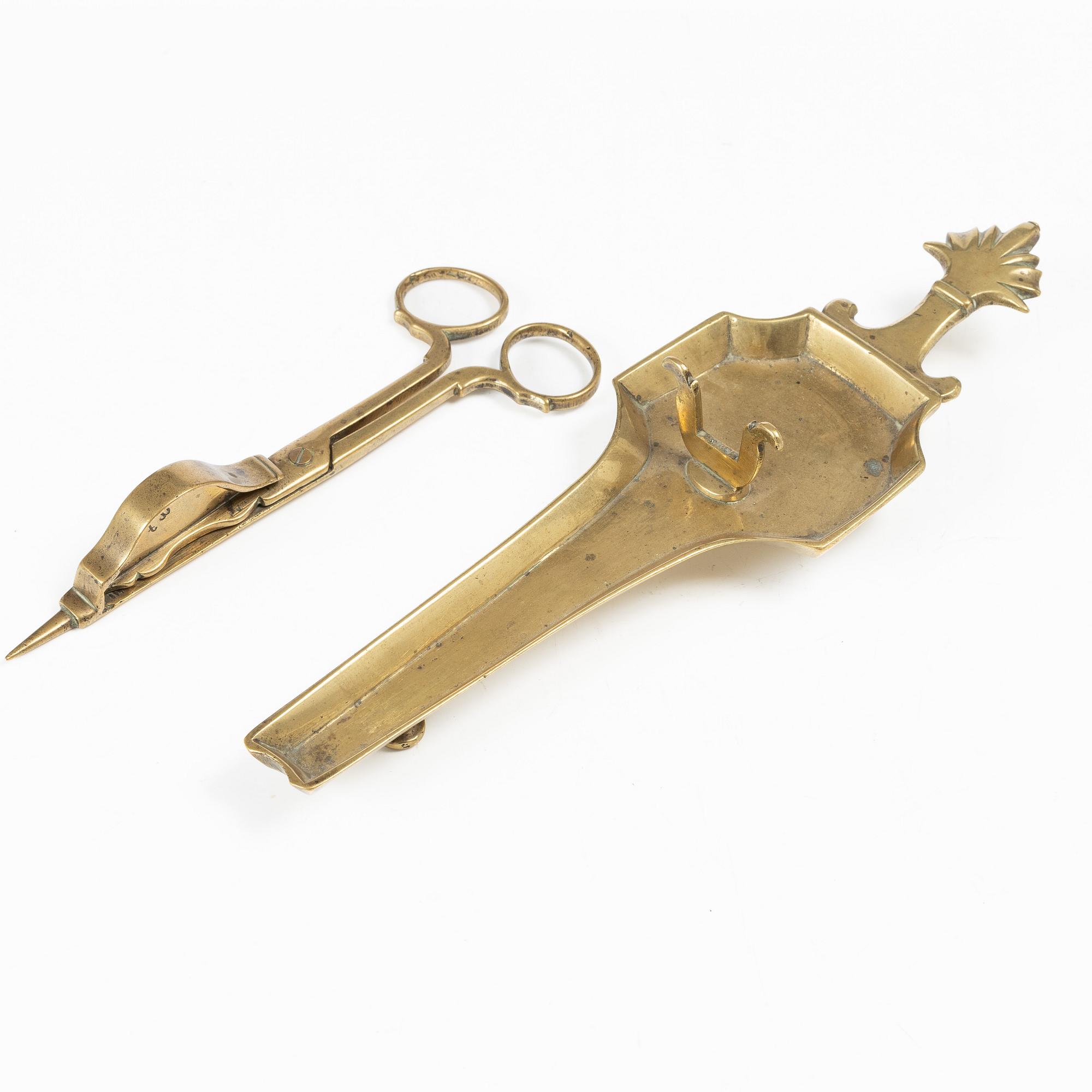 A Swedish/North European baroque brass wick snuffer and tray, circa 1700.