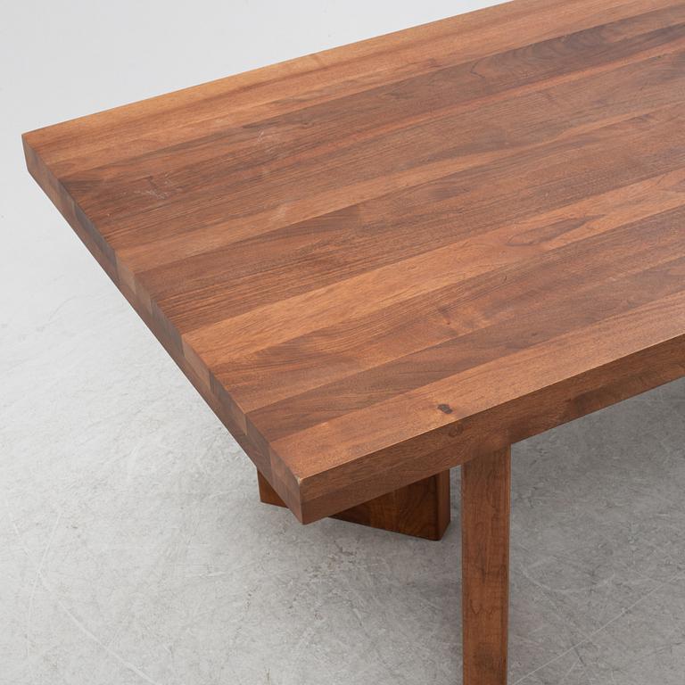 Dusty Deco, a contemporary walnut dining table.