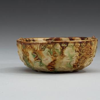 A sancai glazed pottery bowl, Tang dynasty (618-907).