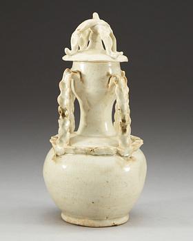 A pale green glazed vase with cover, Yuan dynasty (1271-1368).