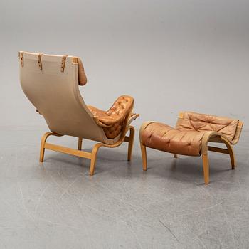 Bruno Mathsson, a "Pernilla" lounge chair with ottoman, DUX, Sweden, late 1900's.