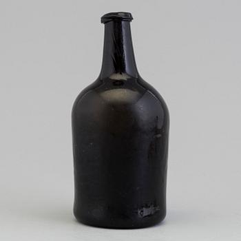 An 18th Century glass bottle.